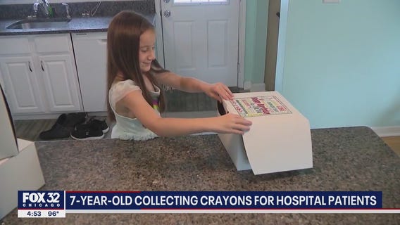 7-year-old suburban girl collecting crayons for hospital patients