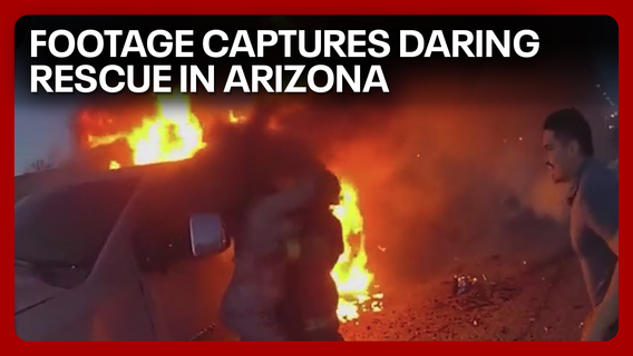 Officer's heroic efforts save woman from burning car