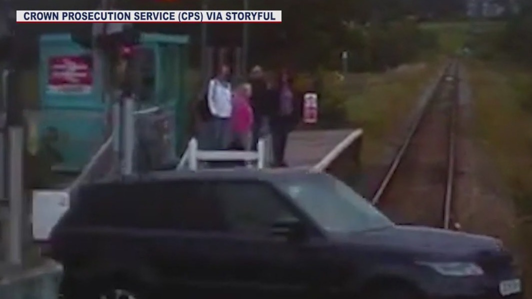 Driver has scary near-miss with train