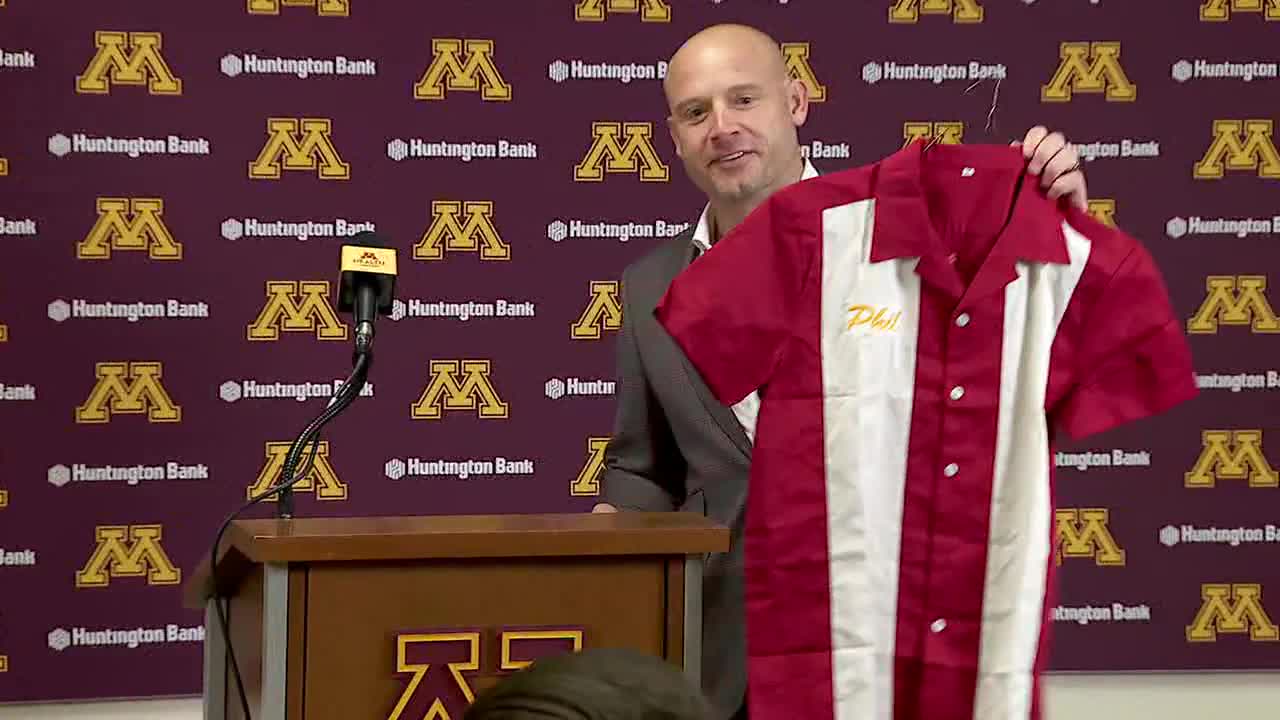 Gophers' Fleck gifted bowling shirt at Wisconsin presser