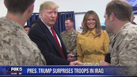 Trump makes unannounced visits to American troops in Iraq, Germany