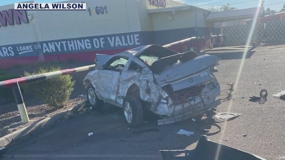 Driver, passenger unhurt in fiery rollover crash