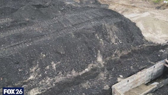 Deep pits of toxic ash along Buffalo Bayou