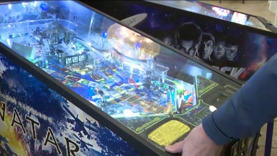 Playing pinball at the Ingleside Hotel arcade