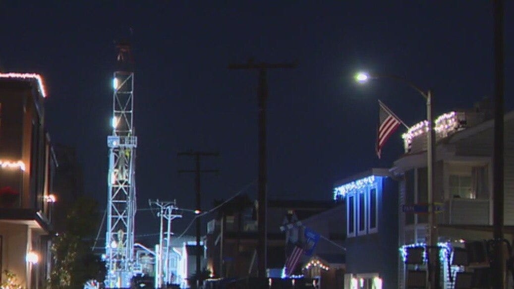 Crews repairing leaking oil well in Newport Beach