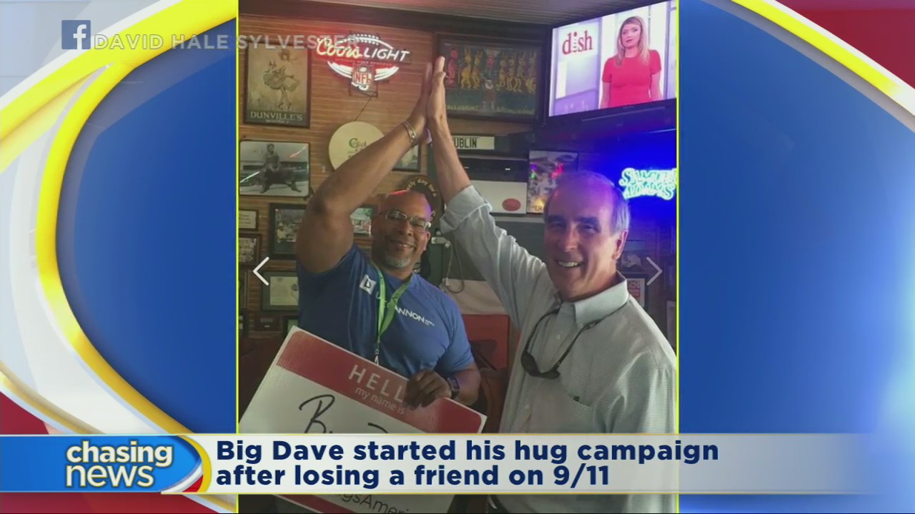 Big Dave travels the globe giving hugs and high-fives