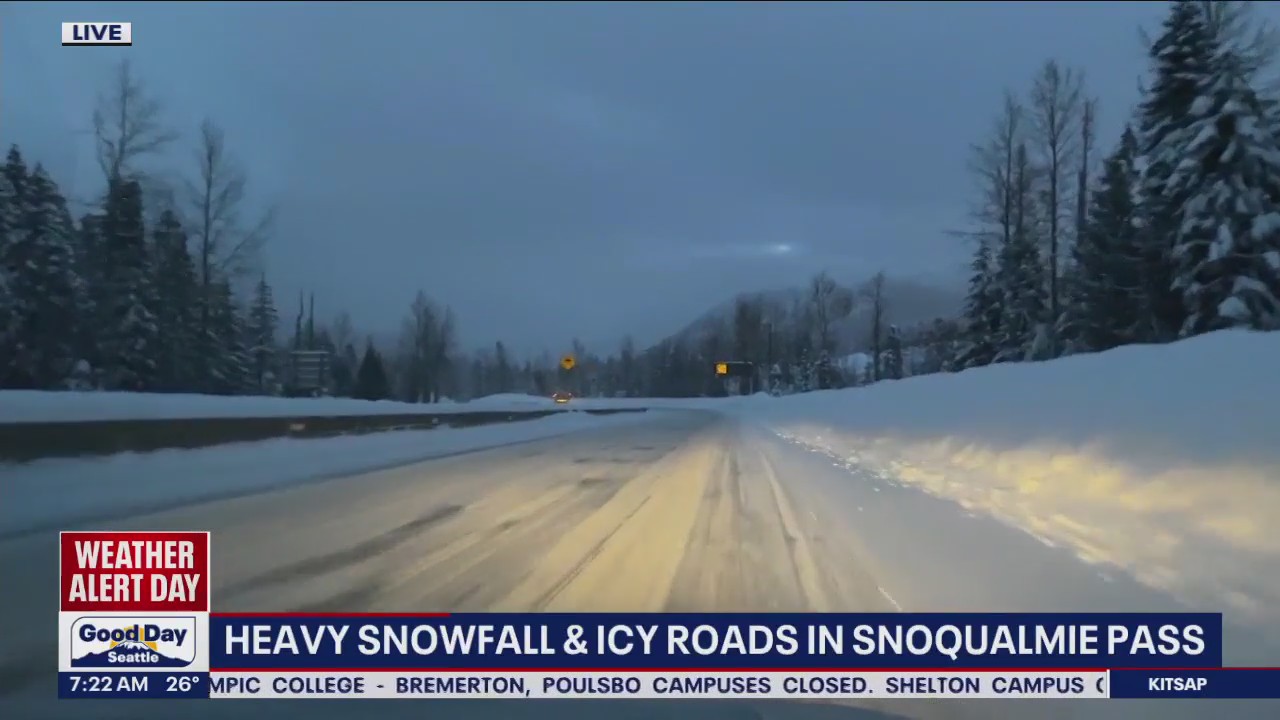 Heavy snowfall, icy road conditions over Snoqualmie Pass