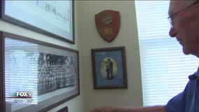 A Korean War veteran reacts to the remains of U.S. soldiers returning