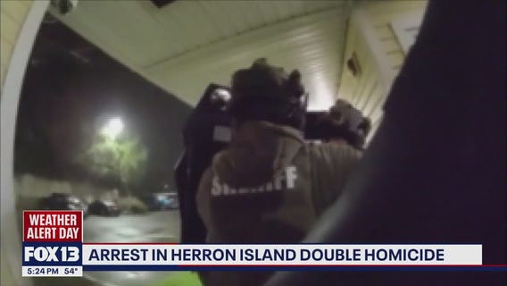 Suspect arrested after two people found dead in Heron Island home