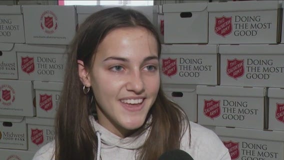 Volunteers in Elk Grove Village pack holiday meal boxes for families in need