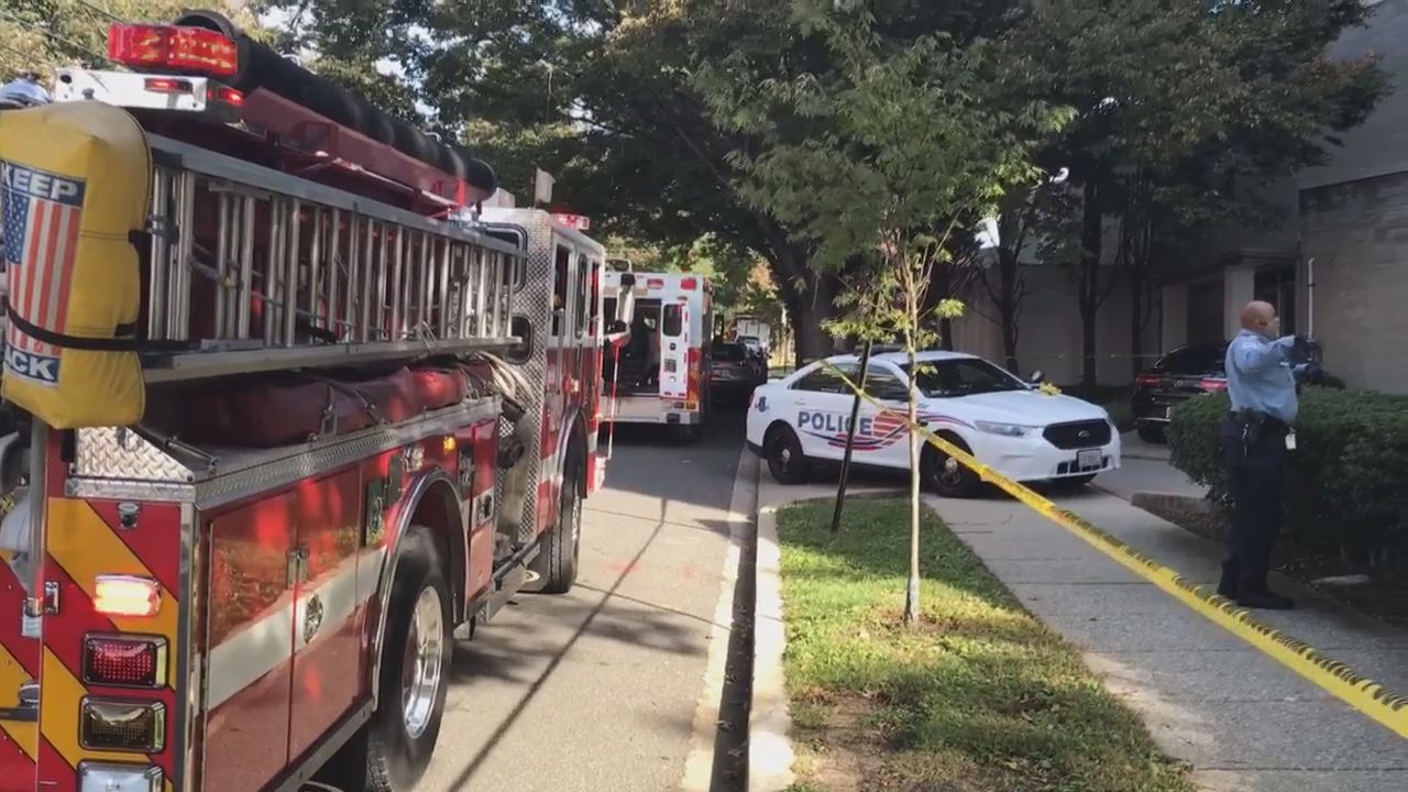 Scene outside of FOX 5's building after suspect was shot by security