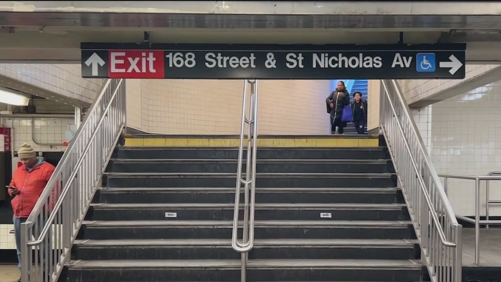 Woman pushed onto side of moving NYC subway train