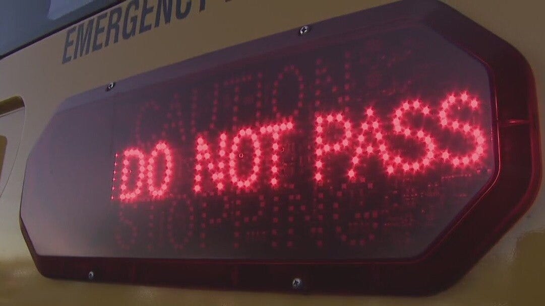 Driver illegally passes stopped AISD school bus