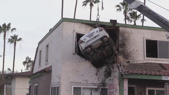 Car crashes into second floor of Santa Ana building