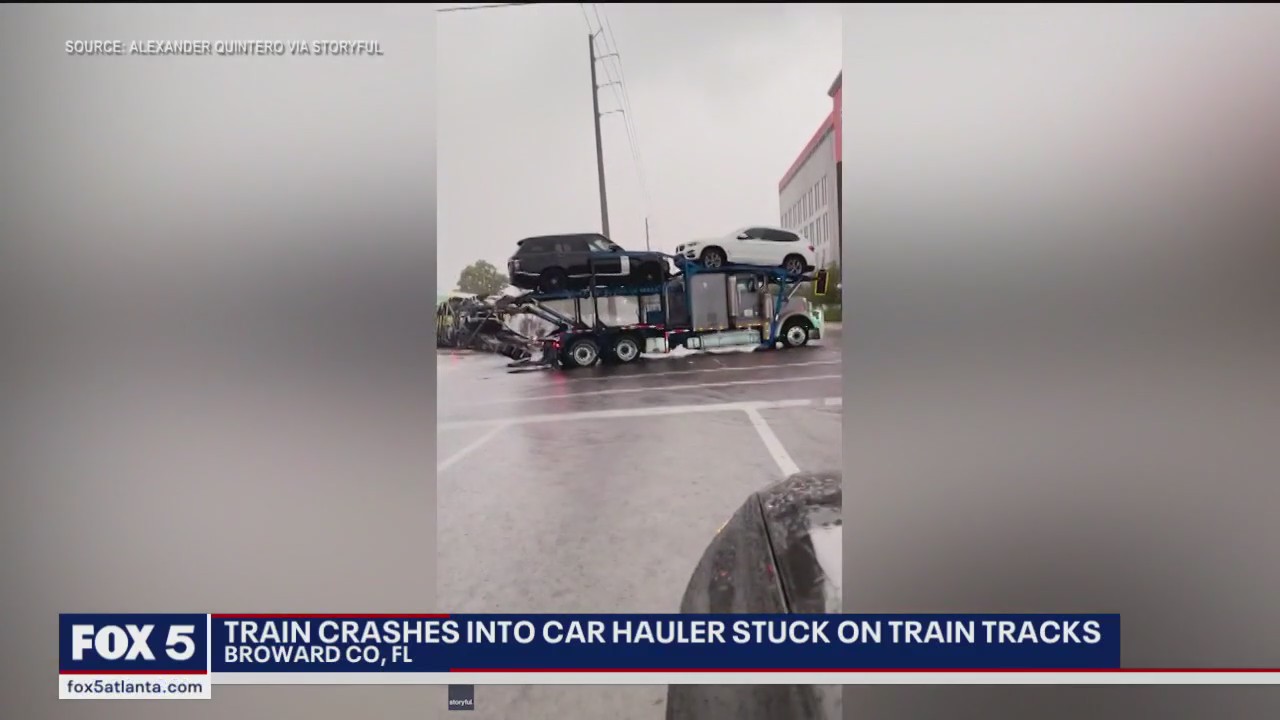 Train crashes into car hauler stuck on tracks | FOX 5 Atlanta