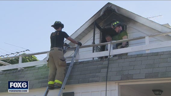 Racine house fire; man rescued from balcony