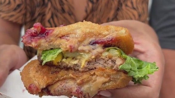 Maxx tries the Uncrustaburger at the State Fair