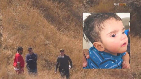 Dad of Emmanuel Haro with cops in search for baby