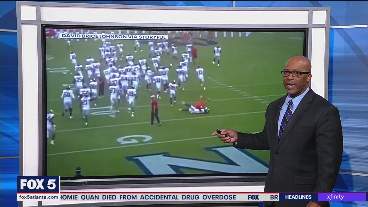 Cheerleader knocks down football player | FOX 5 Atlanta