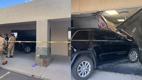Woman crashes car into Mesa building