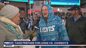 Lions fans tailgate in the bitter cold before Cowboys game