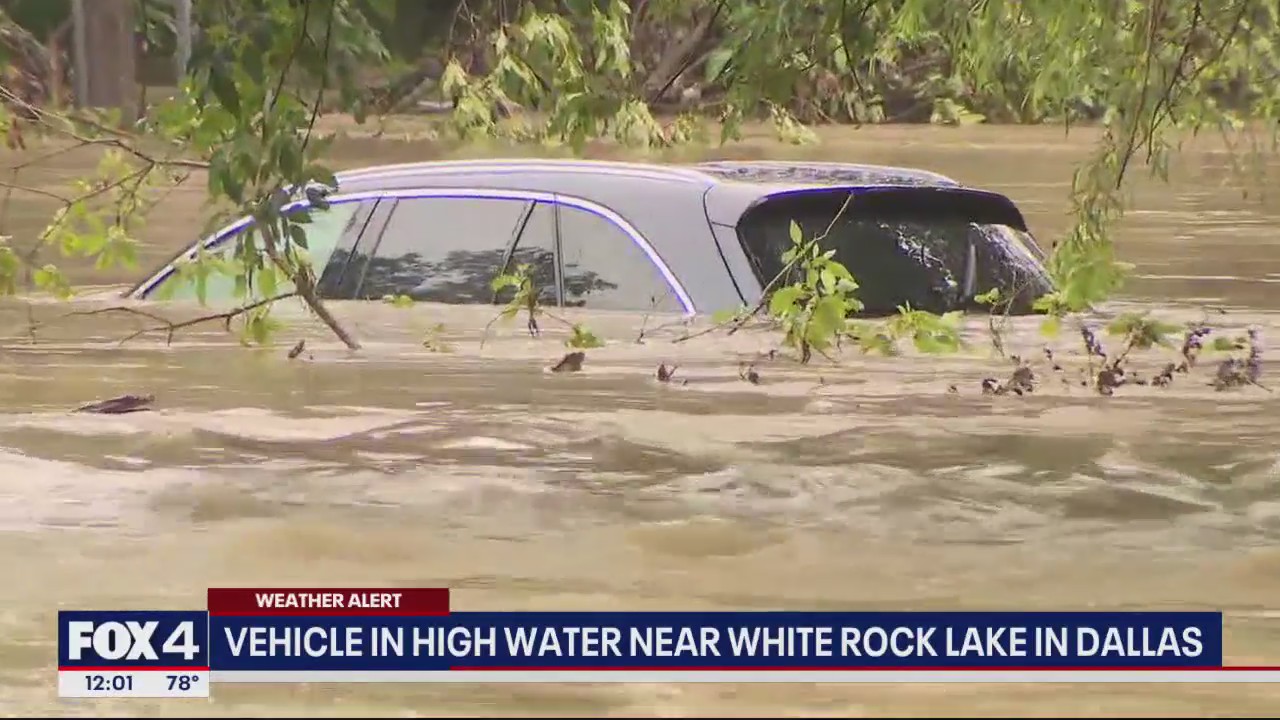 Vehicle submerged in high water near White Rock Lake