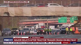 Massive delays after tractor-trailer strikes overpass on I-495
