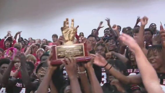 Raising the HIGH 5 Sports TOTW trophy at Druid Hills High