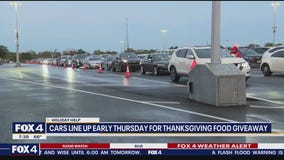 Residents line up early for Thanksgiving food giveaway