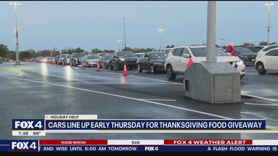 Residents line up early for Thanksgiving food giveaway