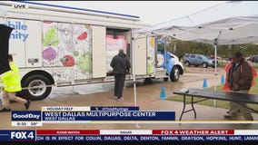 Cars line up for turkey distribution in West Dallas