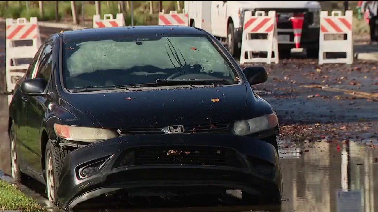 Menlo Park flooding: Cars partially submerged as firefighters wade through water