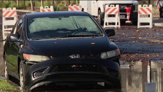 Menlo Park flooding: Cars partially submerged as firefighters wade through water