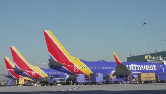 Southwest to start charging for checked bags