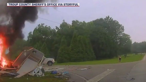 Deputy pulls elderly couple from burning car
