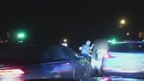 Caught on camera: Officer hit by car while helping stranded driver