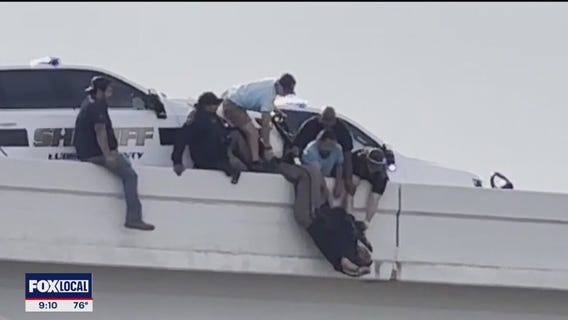 Lubbock bystanders rescue deputies pinned by patrol car