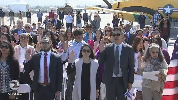 New U.S. citizens naturalized on USS Hornet in Alameda