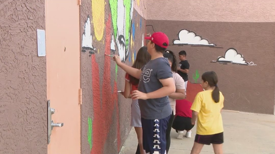 Phoenix Rising soccer team takes part in beautification project at Phoenix elementary school