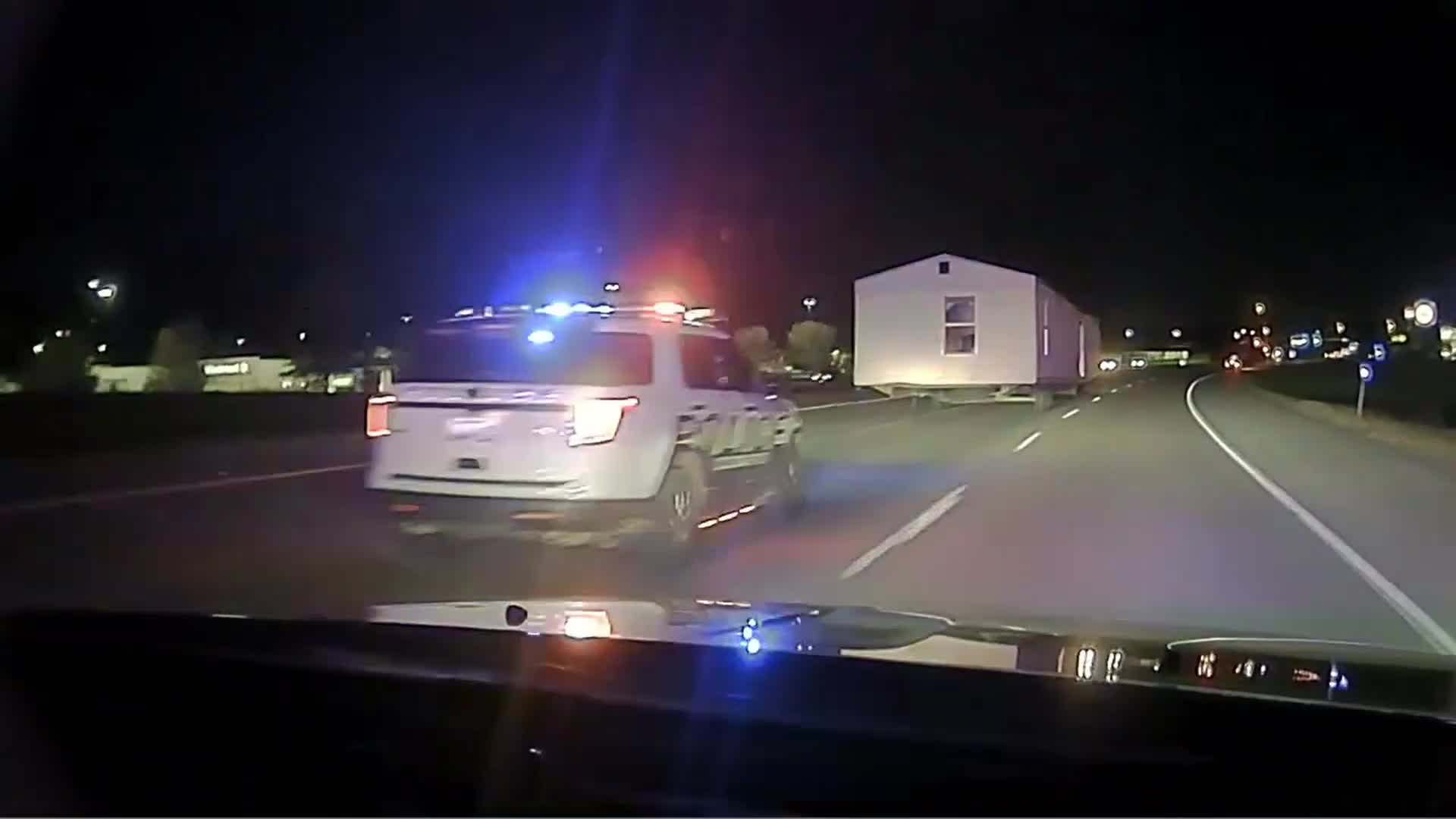 Police chase of truck towing house