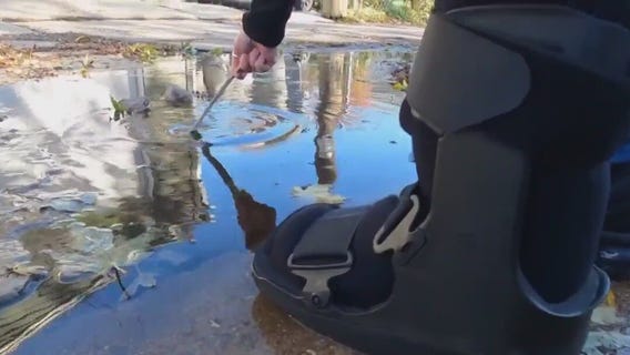 Alley potholes, woman wants concrete replaced