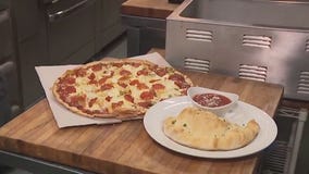 Preparing pizzas, calzones at Tenuta's