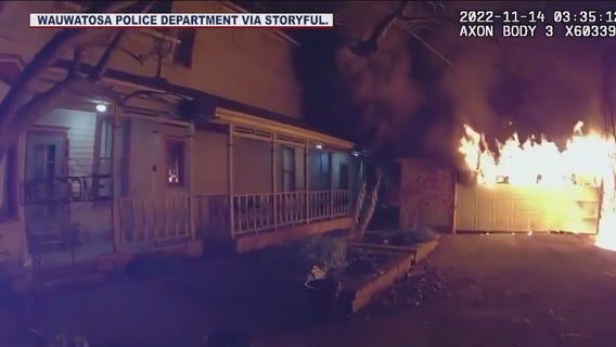 Wisconsin police officer wakes residents after spotting garage on fire