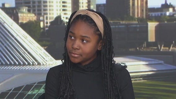 MacKenzie helps Rob Haswell with the weather