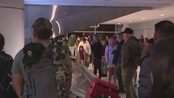 Sky Harbor is busy with holiday travel as delays and cancelations plague flights