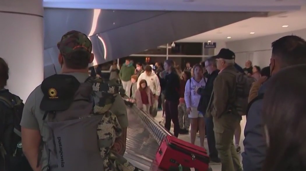 Sky Harbor is busy with holiday travel as delays and cancelations plague flights