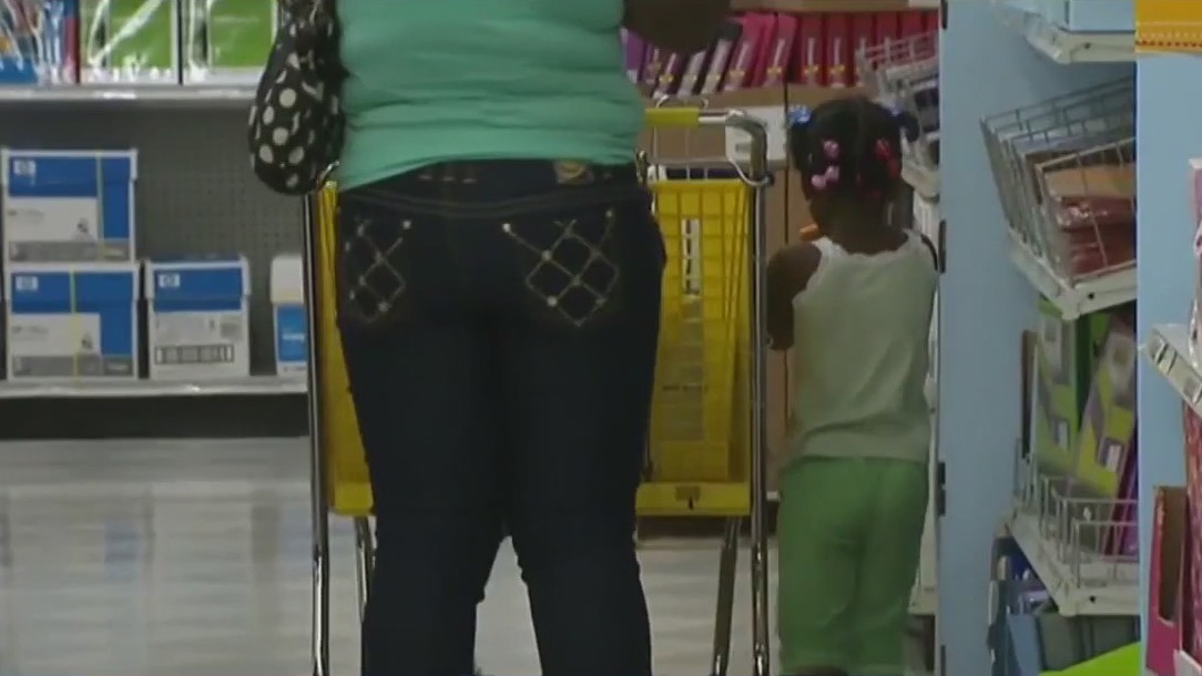 Bringing kids makes shopping more expensive, report says