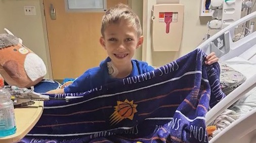 'They inspire me': Suns super fan battling leukemia cheers the team on from Phoenix Children's