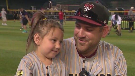 Dads play catch at Chase Field for Father's Day