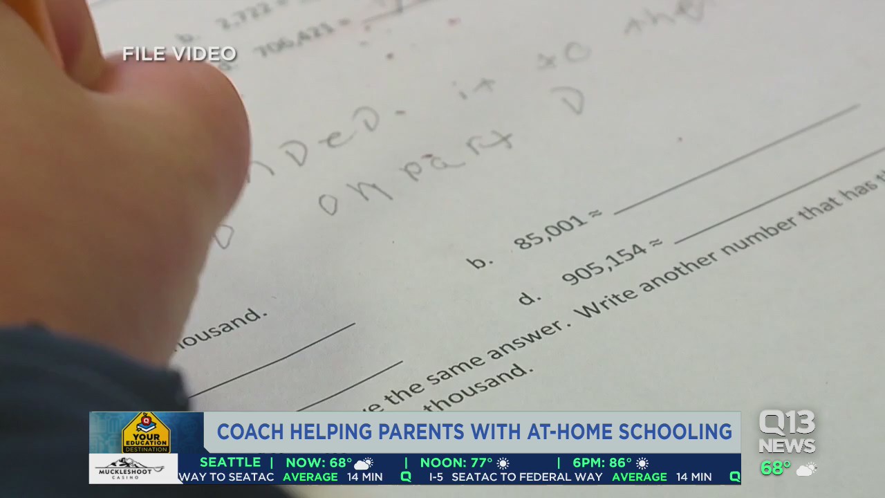 Coach helping parents with home schooling